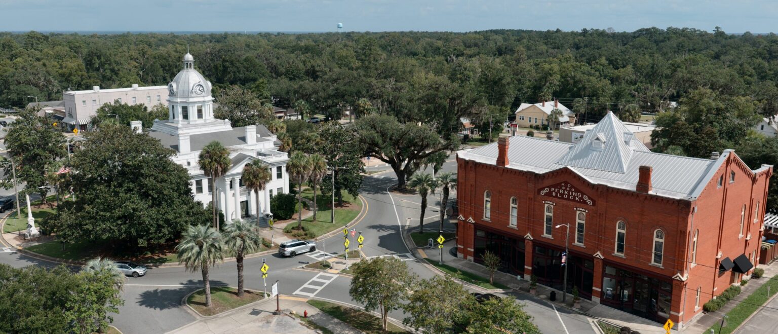 Aerial view of the Jefferson County Courthouse and the historic Perkins Block in downtown Monticello, Florida