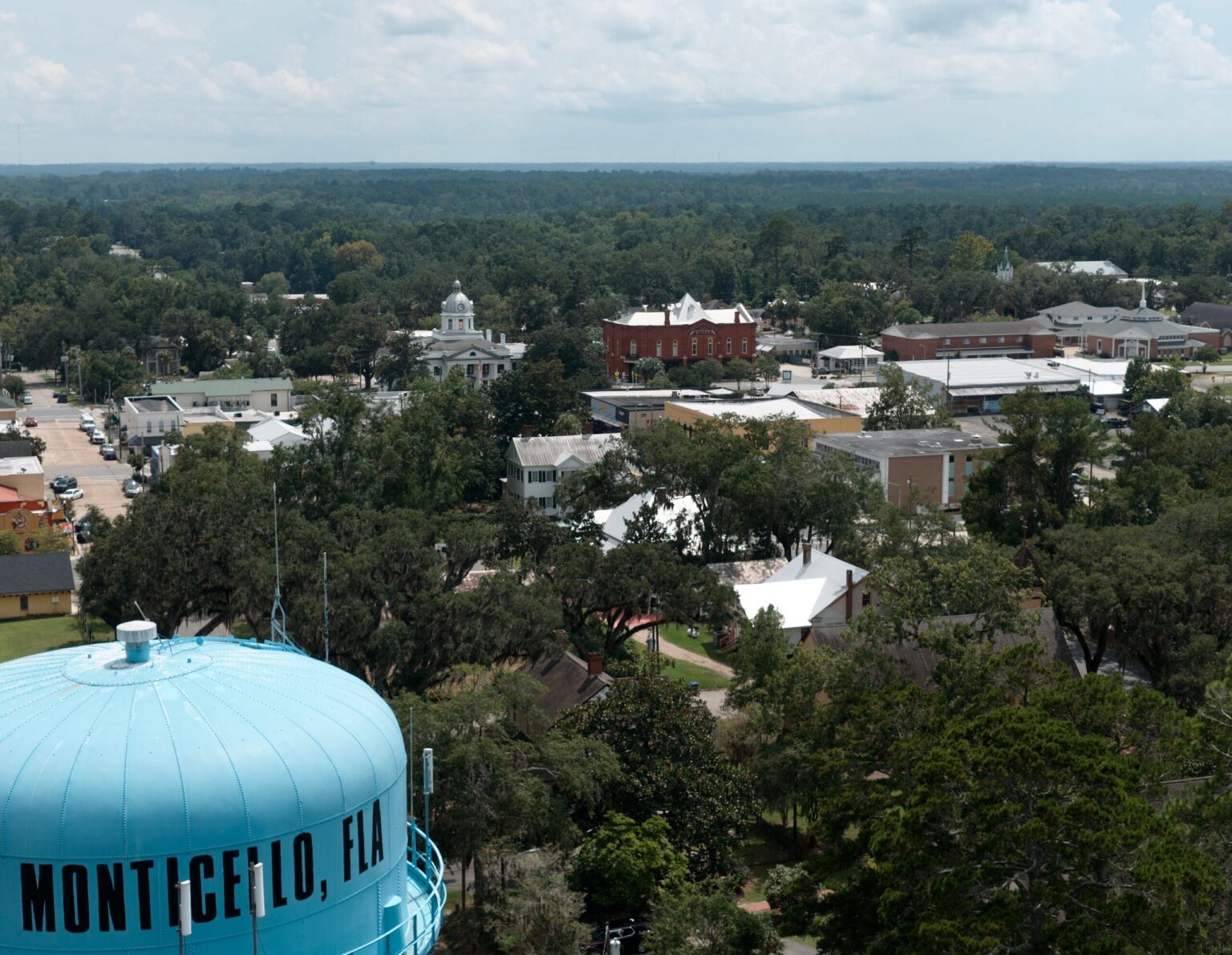 Aerial view over the Monticello water tower looking toward downtown and the courthouse